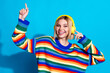 © deagreez - Photo portrait of pretty young girl headphones listen music dance wear trendy striped outfit isolated on blue color background
