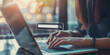 © Annamorphosis - A woman is typing on a laptop with a search bar on the screen