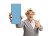 © Ljupco Smokovski - Elderly gentleman pointing at a blue screen on a smartphone