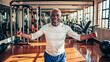 © OpticalDesign - Healthy mature african american man lifting weights in the gym, happy old man exercising with dumbbells, active elder black man training hd, senior fitness health