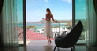 © Anastasia Pro - Tourist female have morning coffee on balcony terrace exotic resort hotel enjoy ocean view. Elegant girl relax in Phuket, Thailand. Outdoor lifestyle travel summer holiday vacation on tropical island.