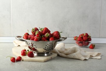 Sticker - Metal colander with fresh strawberries on grey countertop