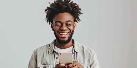 Cheerful african american man using smartphone.