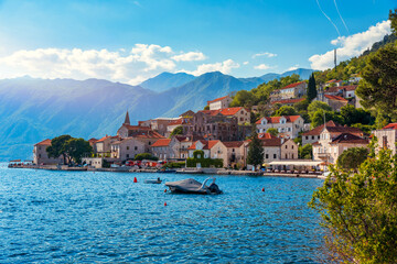 Wall Mural - View of the historic town of Perast at famous Bay of Kotor on a beautiful sunny day with blue sky and clouds in summer, Montenegro. Historic city of Perast at Bay of Kotor in summer, Montenegro.