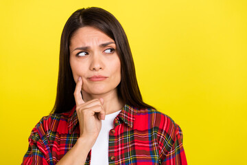 Canvas Print - Photo of doubtful attractive lady dressed checkered shirt finger cheek looking empty space isolated yellow color background