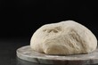 © New Africa - Raw homemade dough on black table, closeup