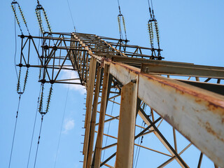 Bottom view over the electric power high voltage transmission line tower in Kyiv, Ukraine. Electric power industry concept.