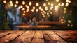 © Farid - image of wooden table in front of abstract blurred background of resturant lights