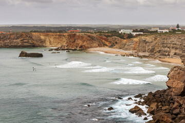 Wall Mural - Elevated view of Praia do Tonel beach, Algarve, Portugal. The beach offers strong waves that draw surfers and paddle boarders