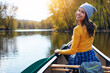 © peopleimages.com - Woman, back and canoeing for water portrait in nature, wellness hobby and single blade paddle for rowing. Vacation, relax and explore exercise on travel in summer, canoe boat and trees on river