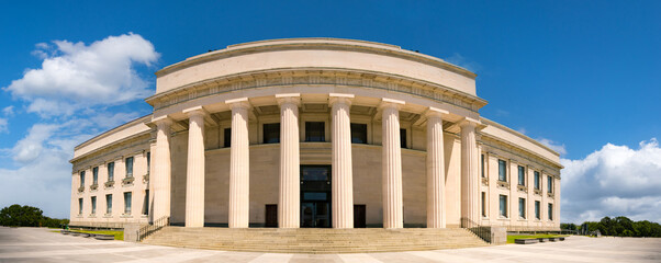 Canvas Print - building in classical Greek style with columns against a blue sky