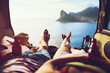© peopleimages.com - Couple, feet and van with view on road trip in Cape Town, beach vacation with relax in summer. People, transport and ocean with mountain for freedom in nature, bonding on holiday for wellness