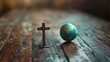 © Bijac - christian cross and earth globe on wooden floor conceptual image of world religion and faith