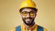 © Pixelpur - A happy male engineer wearing yellow helmet, looking straight into the camera, full body till waist, placed extreme right side, light yellow background