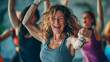 © mattegg - A group of middle-aged women are energetically engaging in a dance class, moving in sync to the music and following the instructors steps with enthusiasm and focus.