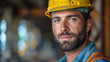 © Image-Love - A man with a hard hat and beard is standing in front of a building
