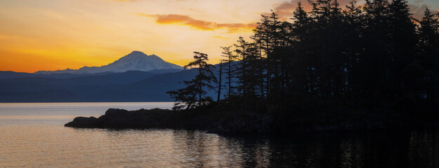 Wall Mural - Abner Point on Lummi Island with Mt. Baker in the background. Seen from the Aiston Preserve with Smugglers Cove in the foreground and Bellingham Bay and the city of Bellingham in the distance.