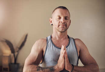 Yoga, man and namaste for exercise, breathing and spiritual awareness or reiki balance. Male person, self care and healing aura for mental health or relax in studio, mindfulness and peace or calm