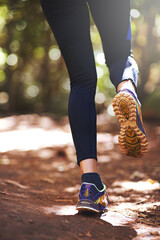 Wall Mural - Shoes, runner or person running on trail in nature on outdoor adventure to explore in terrain footwear. Athlete, forest or hiker trekking in woods for training, wellness or travel journey for fitness