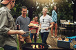 © peopleimages.com - Friends, barbecue and serving with plate in backyard with diversity cooking and choice with meat on fire. People, men and women with beer, happy and relax with food by bbq grill on holiday in Florida