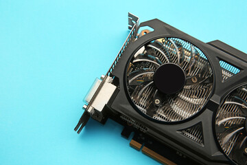 Poster - One graphics card on light blue background, top view. Space for text