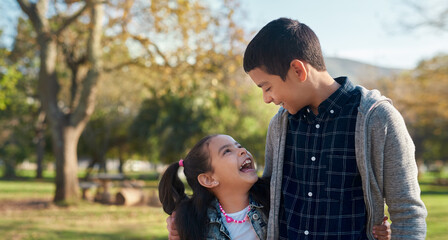 Canvas Print - Happy, children and siblings on holiday at park for outdoor adventure, bonding and fun at countryside. Playful, girl and boy with smile in nature for summer vacation, carefree and joy in childhood