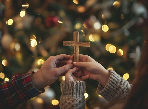 close up of two hands holding wooden cross, beautiful bokeh background, emotional scene, family gathering during Christmas time,