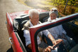 © peopleimages.com - Senior, couple and road or driving convertible for retirement date or holiday adventure, vineyard or transportation. Man, woman and old people in luxury car in California for morning, travel or relax