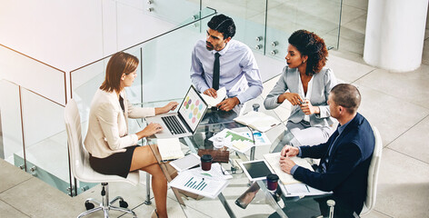 Poster - Group, business people and manager with laptop on table for financial meeting, pitch or presentation. Team, accountant and collaboration in office with computer for economy, documents for strategy