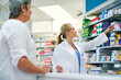 © peopleimages.com - Pharmacist, shop and help customer with medicine, pills or drugs on shelf for healthcare. Pharmacy, shopping and woman in store with sale, choice or prescription antidepressants, antibiotics or stock