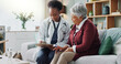 © peopleimages.com - Black doctor, mature patient or paper in consultation, advice or trust as electronic medical record. Female physician, older woman or tech to support, help or discuss in professional health clinic