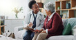 © peopleimages.com - Black doctor, mature patient or paper in consultation, advice or trust as electronic medical record. Female physician, older woman or tech to support, help or discuss in professional health clinic