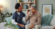 © peopleimages.com - Elderly, man and water from nurse for medicine, healthcare and support for dementia. Sick, patient and senior caregiver with person in home to help with tablet, supplements and alzheimer drugs