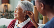 © peopleimages.com - Nurse, woman and hearing aid on ear for medical support, wellness and innovation of disability. People, healthcare worker and deaf patient with audiology implant, service or help for sound waves
