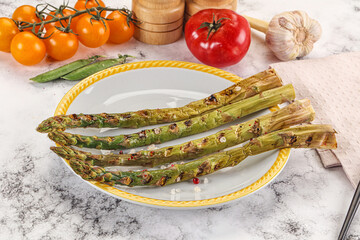 Canvas Print - Grilled asparagus sprouts served red pepper