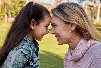 park, forehead and mother with girl, love and sunshine with nature, bonding together and weekend bre