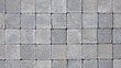 © OceanProd - gray abstract pattern background of grey red cobblestone pavement in close-up top view
