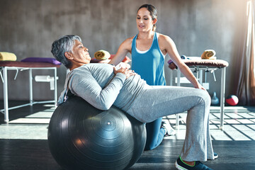 Poster - Stretching, physiotherapist and senior woman with ball in clinic for physiotherapy, support or exercise. Wellness, healthcare worker and elderly patient for balance, recovery or rehabilitation