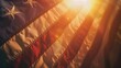 © CHAWA GEN - A close-up of a weathered American flag waving proudly, backlit by a warm, glowing sunset, symbolizing freedom and resilience