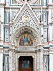 Wall Mural - Florence, Italy - April 10, 2024: Florence cathedral with surrounding area full of tourists in Florence, Italy