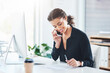 © peopleimages.com - Businesswoman, assistant and phone call with paperwork in office for meeting confirmation, schedule or networking. Female person, talking and contact us for corporate consultation, cellphone or notes