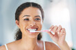 © peopleimages.com - Morning, bathroom and woman with teeth whitening in home for dental hygiene, wellness or oral care with product. Cleaning, brush and girl with toothpaste for fresh breath, toothbrush and pride