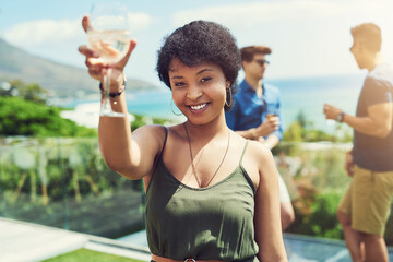 African woman, toast and portrait at party with drink, champagne and smile with celebration in summer. Person, girl and happy with glass, excited and cheers at social event with friends in summer