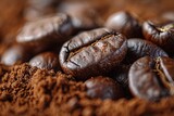 Close-up of roasted coffee beans on ground coffee background.