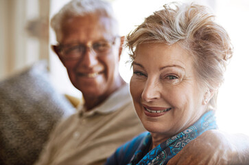 Wall Mural - Portrait, home and senior couple with hug, marriage and retirement with happiness, romance and relationship. Face, old man and mature woman on couch, comfort and trust with love and bonding together