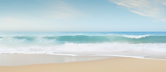 Poster - A tropical beach with blurred waves and sand in the foreground Offers plenty of copy space for your image