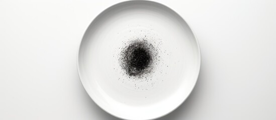 Aufkleber - The ceramic plate has a black circle in the center and is placed on a white background The image can be used as a copy space