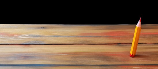 Aufkleber - An isolated image of a crayon wax pencil on a wooden surface with copy space