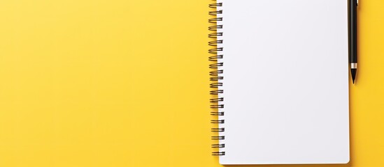 Poster - An isolated yellow background with a white open notepad provides plenty of copy space image