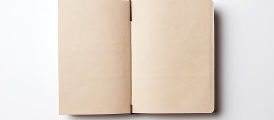 Poster - A high angle view of an empty notebook with a recycled paper cover placed on a white background providing ample space for other images
